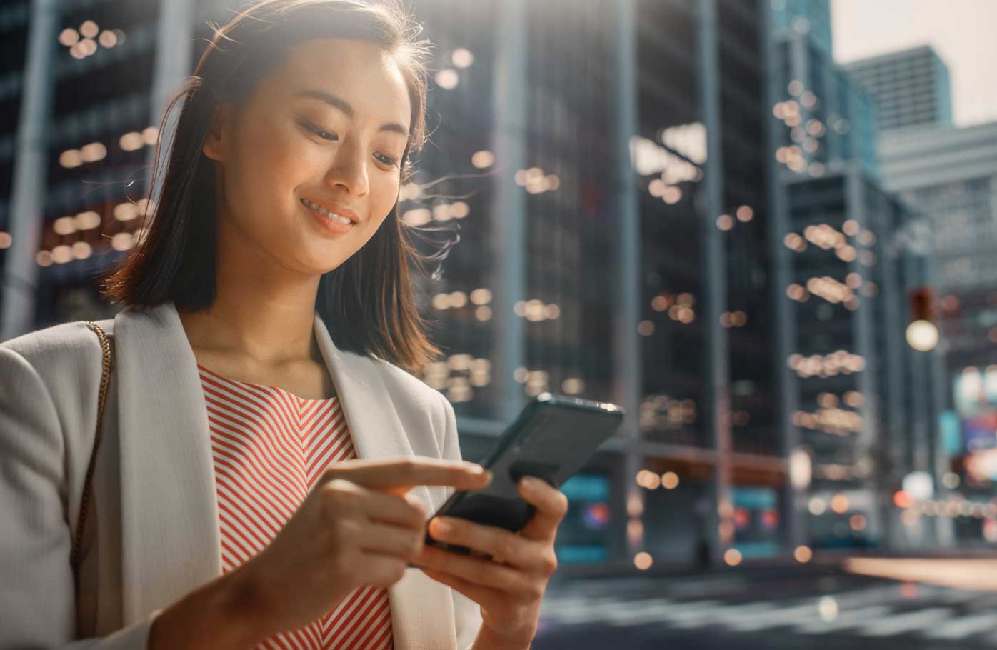 An image of a woman checking her mobile device