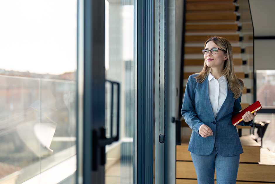 A young woman gazes in the distance, considering new opportunities