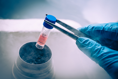 Lab worker extracting stem cells from storage